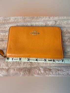 Coach Pebbled Zip Wallet in Bright Orange with Gold Hardware